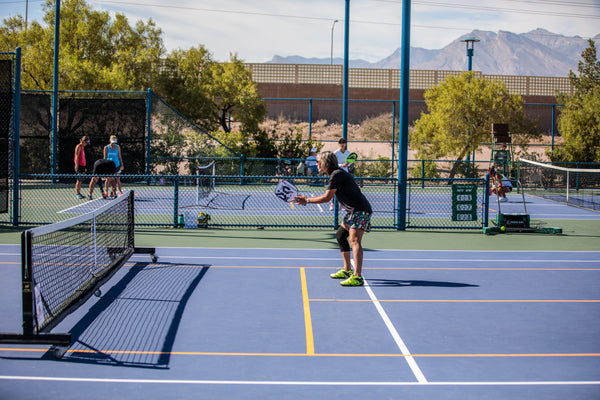 pickleball players on outdoor pickleball court 